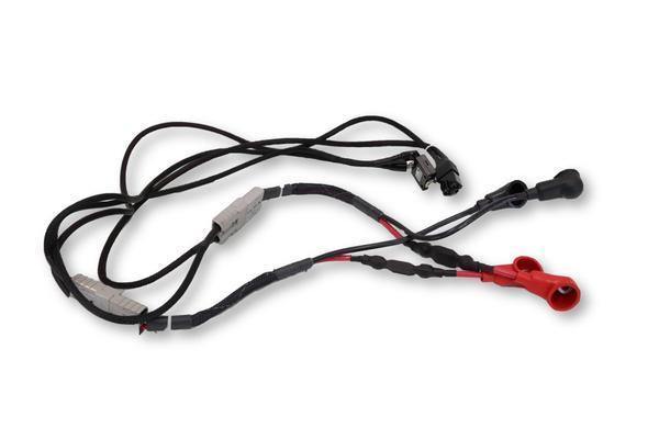 a bundle of black cables with multiple red and black connections