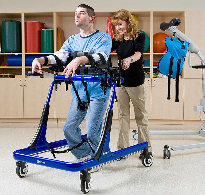 Young Adult Demoing Rifton Pacer Gait Trainer