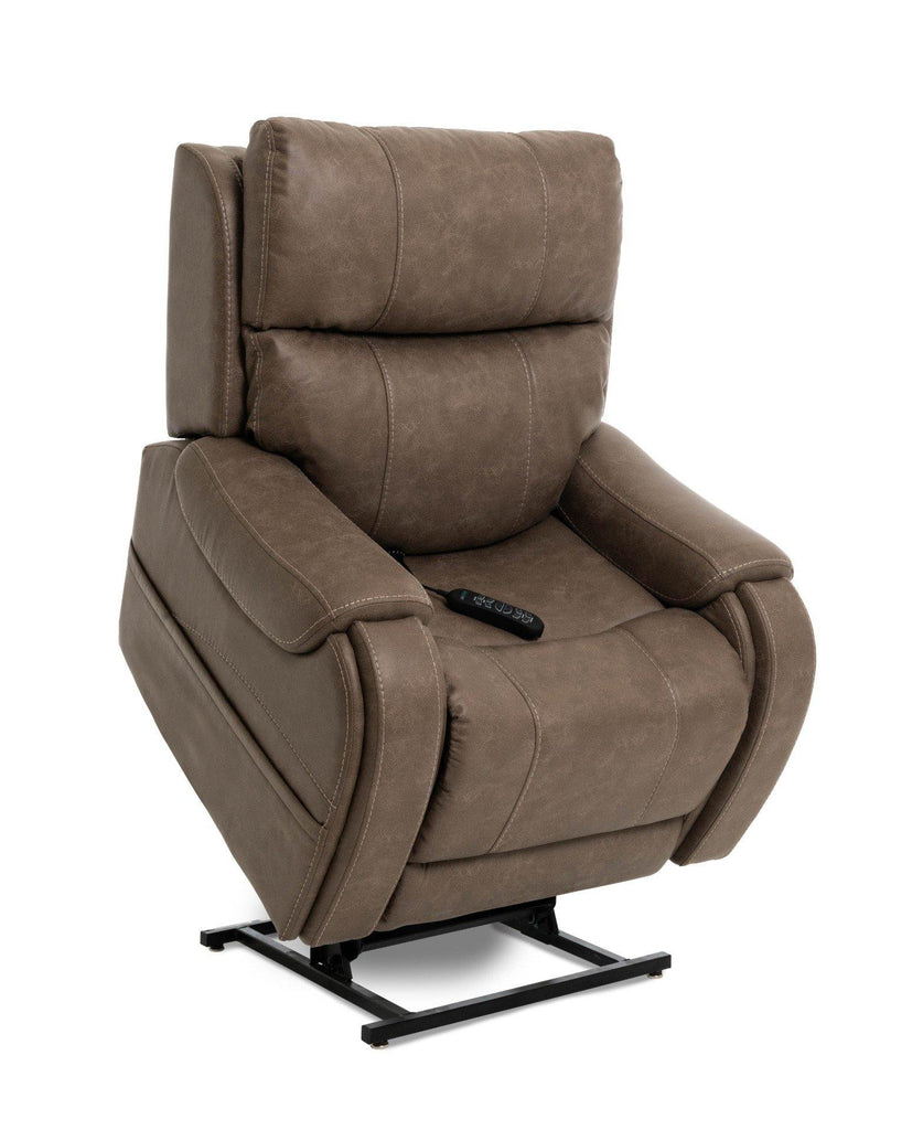 a brown tufted leather lift chair recliner with a black control sitting on the seat, viewed from the front in it's lifted position