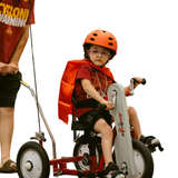 Child in helmet using Amtryke AM12S Adaptive Tricycle