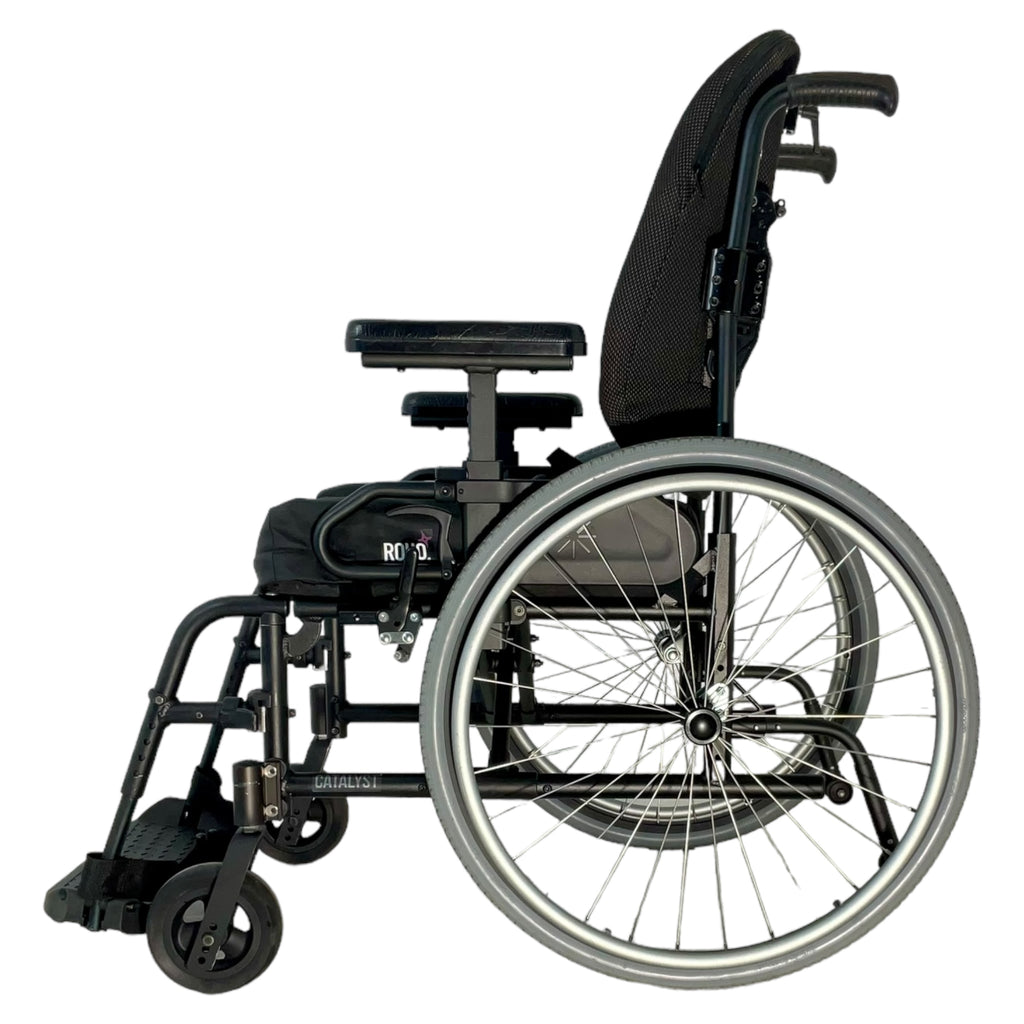 Left profile view of Ki Mobility Catalyst 4 wheelchair