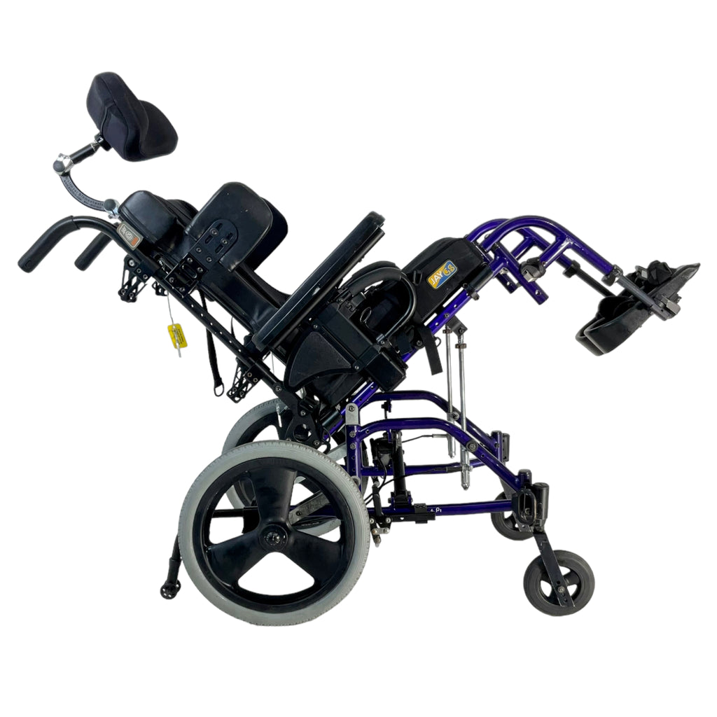 Right side view of tilted Sunrise Medical Quickie Zippie TS tilt-in-space wheelchair