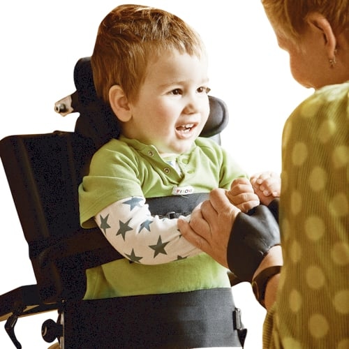 Child in an Etac Caribou with a smiling adult, on a white background