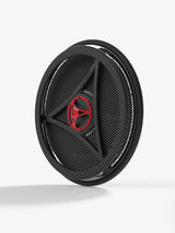 A circular black speaker grille with a carbon fiber pattern, featuring a red and black central logo, shown on a light gray background.
