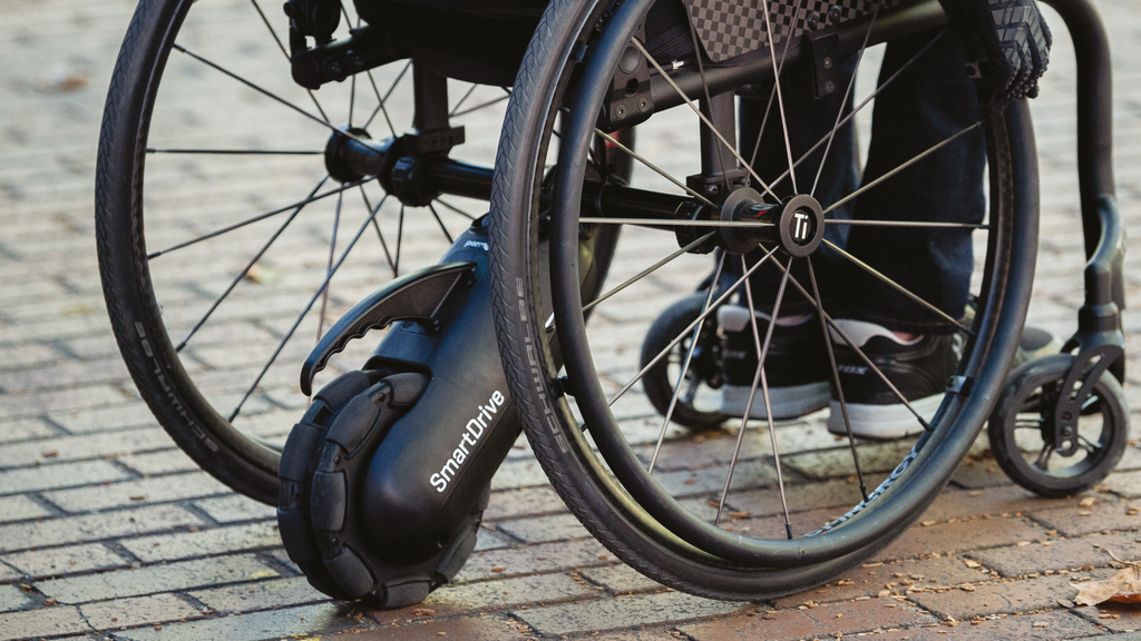 How the SmartDrive MX2+ will look attached to a manual wheelchair